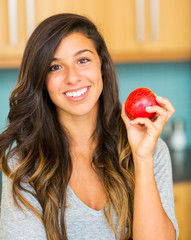 Beautiful Young Woman Holding Red Apple