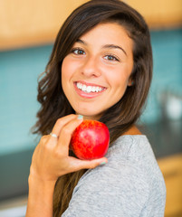 Beautiful Young Woman Holding Red Apple