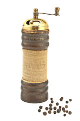 Old pepper mill isolated on white