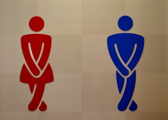 Toilet sign with a man and a woman