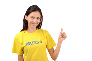 Thumbs up for Sweden.Girl with Sweden flag on her t-shirt