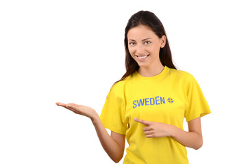 Girl pointing and showing.Girl with Sweden flag on her t-shirt