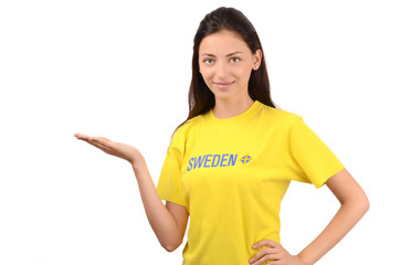 Girl presenting.Sweden flag on her yellow t-shirt.