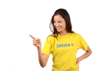 Girl pointing to the side, with Sweden flag on her t-shirt