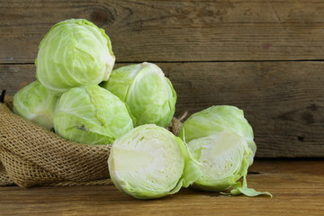 ripe white cabbage on a wooden table