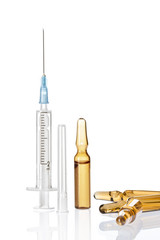 Close up view of  white plastic syringe  on  white back