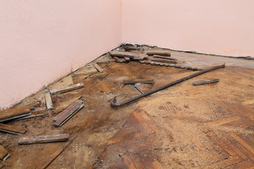 Home renovation old oak parquet demolish with crowbar tool