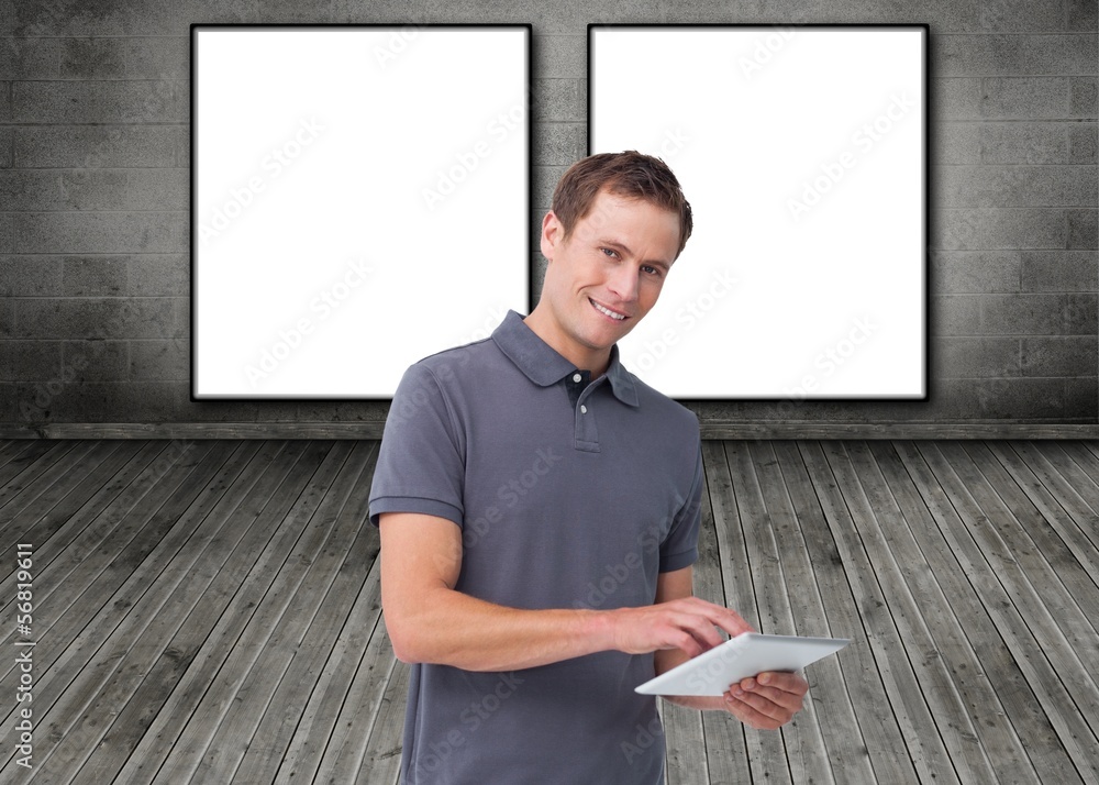 Poster smiling young man with tablet computer