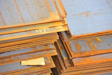 Stacked rusty steel metal sheet, ready for shipment in port