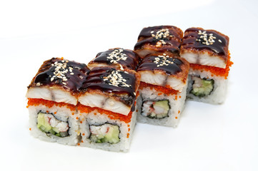 Japanese rolls in a restaurant with fish and vegetables