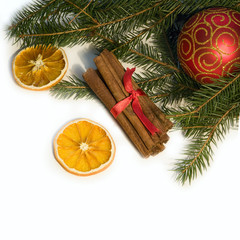 Christmas red ball, twig of fir, orange and  cinnamon