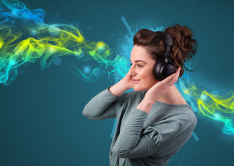 Young woman listening to music with headphones