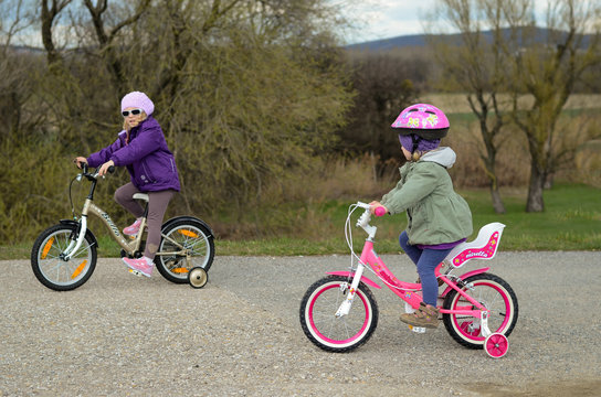 two girls riding a bike
