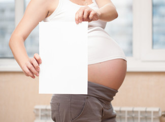 pregnant woman with paper