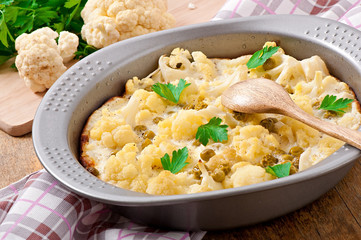 cauliflower baked with egg and cheese with green peas