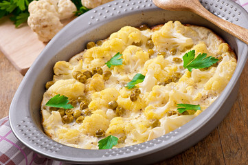 cauliflower baked with egg and cheese with green peas