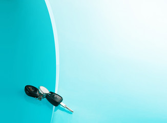 Car keys on blue background