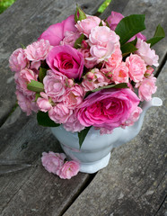 bouquet of roses on wooden surface