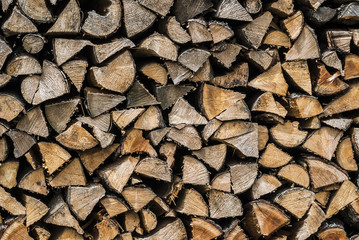 Texture of pile of chopped wood for the fireplace