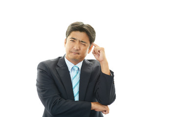 頭痛を訴えるビジネスマン
