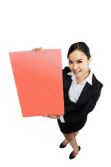 Success woman holding red board shoot in high and wide angle vie