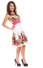 Fashion young woman in summer dress on white
