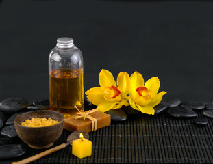 Spa sitting with soap, orchid, massage oil