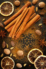 Christmas spices: cinnamon, cardamom, nutmeg on the chalkboard