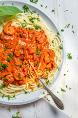 Closeup of fresh spaghetti with prawns and tomato sauce