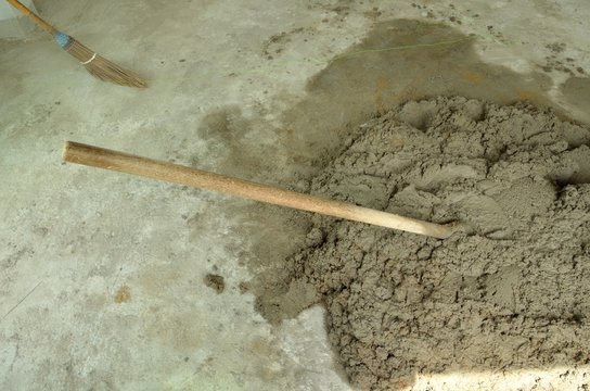 Already Mix Cement On The Concrete Floor.