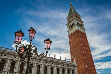 Fototapeta na wymiar Bell tower and street lamp on St. Mark's Square, Venice