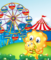 A yellow monster and her child at the carnival