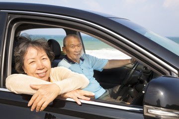seniors couple enjoying road trip and travel