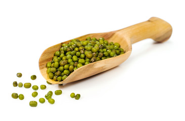 raw mung beans in a wooden scoop