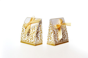 White Gift Box with Gold Ribbon Isolated on a White Background