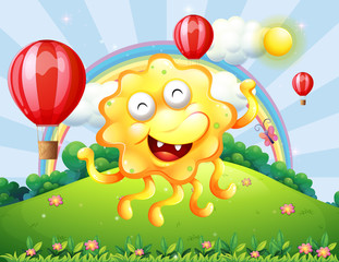A happy yellow monster at the hilltop with a rainbow and floatin