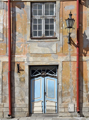 Fototapeta na wymiar Ragged wall of an old building