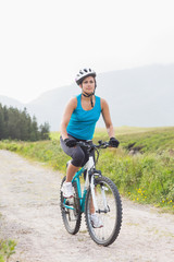 Fit woman riding mountain bike