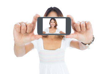 Happy asian woman taking a selfie