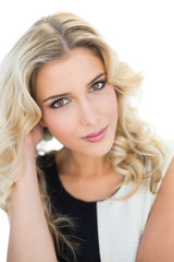 Naklejka premium Smiling attractive blonde model looking at camera