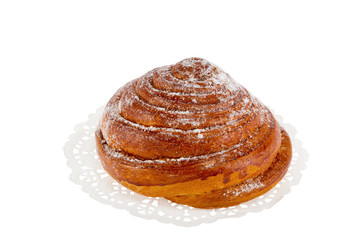 bun on a white napkin with powdered sugar