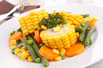 plate of corn and vegetables © M.studio