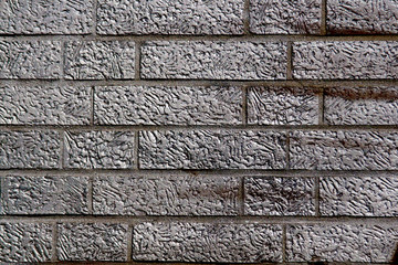 Grunge brick wall filled with cement, horizontal texture