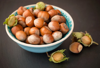 Hazelnuts with shell on the wooden table