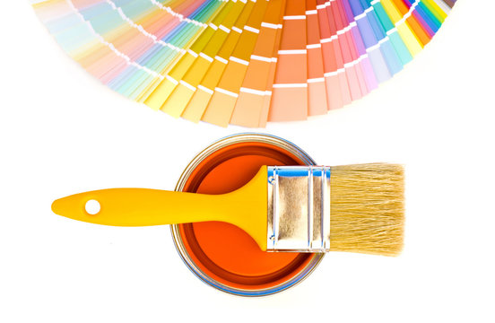 Can Of Orange Paint With A Yellow Brush And Color Swatches.