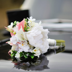 Bridal bouquet  on a car.
