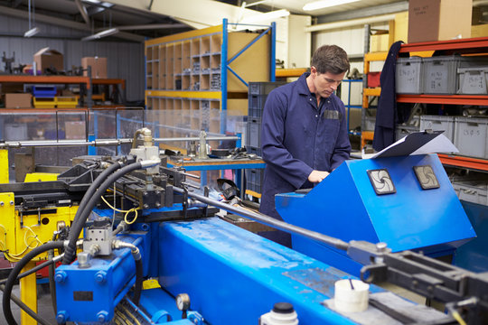 Factory Engineer Operating Hydraulic Tube Bender