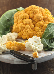 Orange and White Cauliflower on chopping board