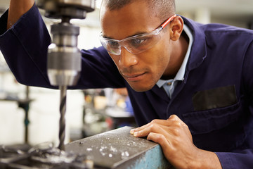 Apprentice Engineer Using Milling Machine © Monkey Business