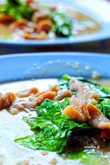 Crispy noodles topped with pork